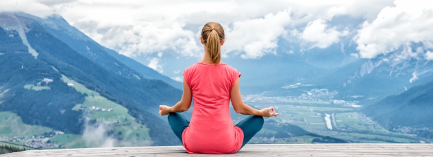 Young woman meditate on top of the mountain © nickolya - stock.adobe.com Meditation